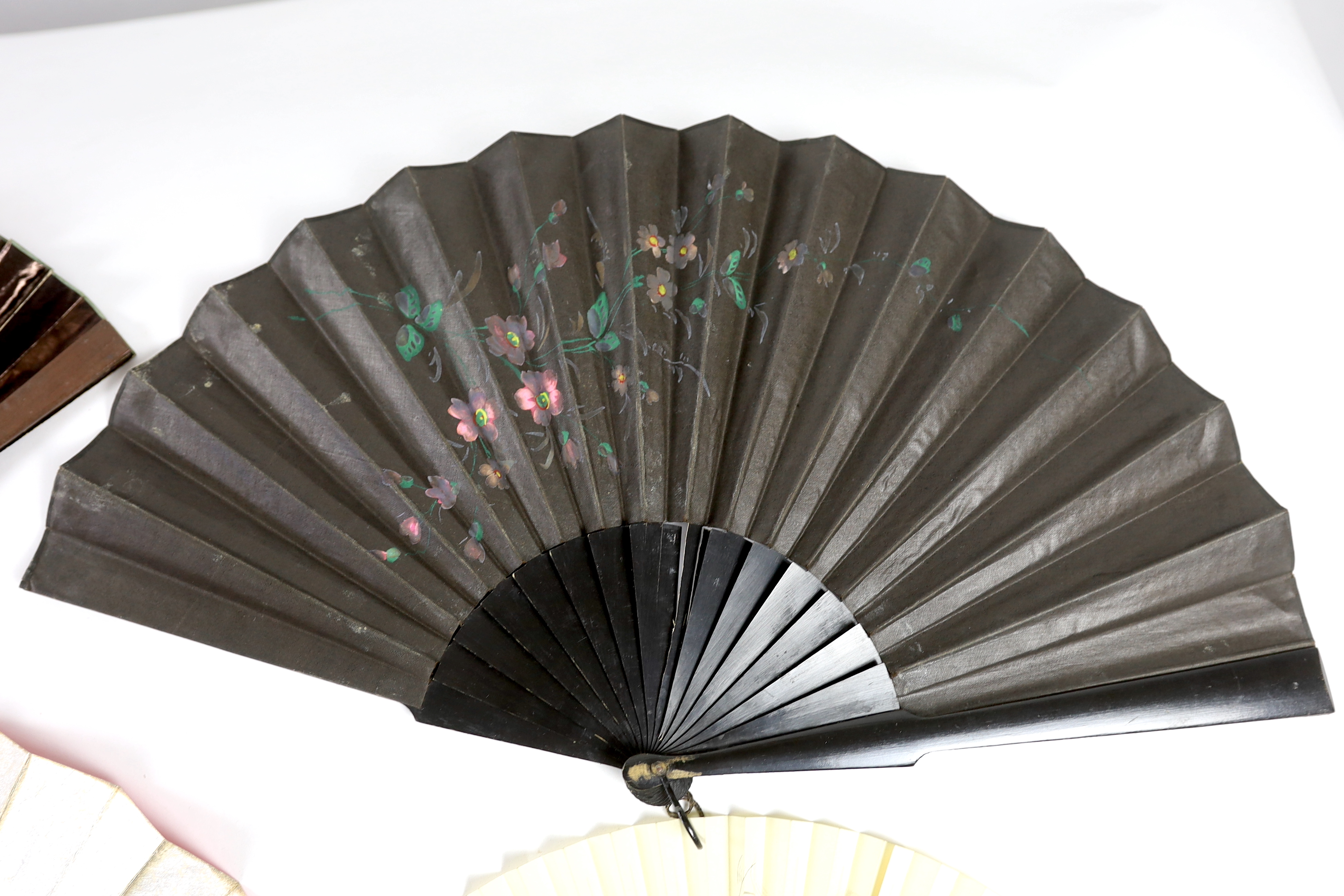 A collection of 19th and 20th century mostly paper fans, ten in reasonable condition useful for stage and film (16)